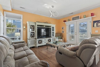 Step into coastal paradise with this exquisite 5-bedroom, 5