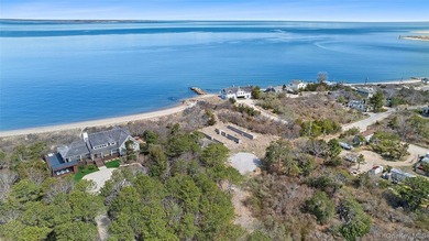 Set on an extraordinary 5.46 acres of direct bayfront in the - photo 2