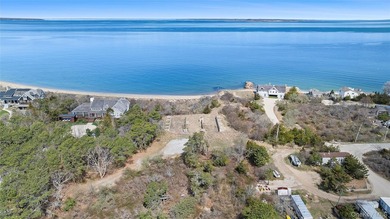 Set on an extraordinary 5.46 acres of direct bayfront in the - photo 3