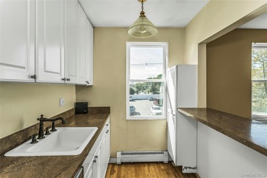 Welcome to the top floor corner unit two-bedroom, one bath co-op - photo 12