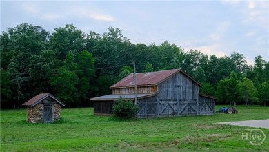 Tucked away on over 15 private acres in highly sought after - photo 1