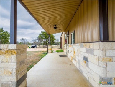 Presenting a stunning metal and stone bardominium set on 18