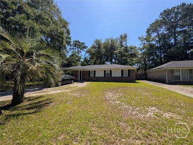 Welcome home to this charming all-brick ranch nestled on a huge - photo 1