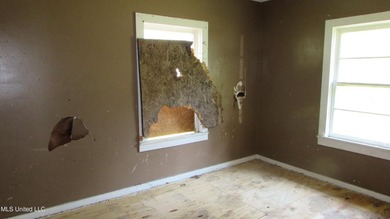 Fixer upper close to town, corner lot with newer metal roof - photo 13