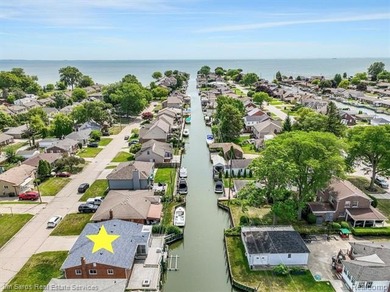 Welcome home to this updated, canal-front, brick ranch, with - photo 2