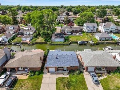 Welcome home to this updated, canal-front, brick ranch, with - photo 4