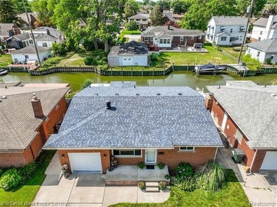 Welcome home to this updated, canal-front, brick ranch, with - photo 5