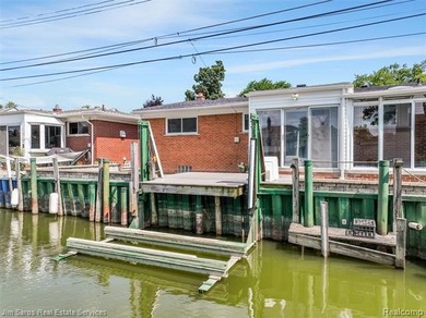 Welcome home to this updated, canal-front, brick ranch, with - photo 9