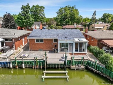 Welcome home to this updated, canal-front, brick ranch, with - photo 10