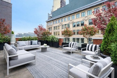 Residence 6/7A is a rare triplex loft-style home occupying the - photo 6