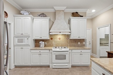 Custom-built home situated in the sought-after location in the - photo 12