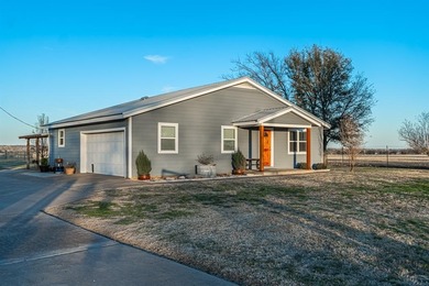 Situated on 2.9 acres, this 2,076-square-foot ranch-style home - photo 2