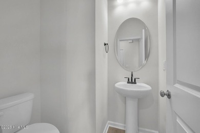 This spacious townhome boasts a first-floor primary suite, and - photo 12