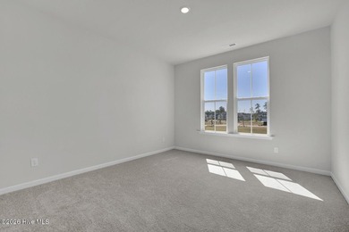 This spacious townhome boasts a first-floor primary suite, and - photo 22
