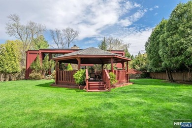 Set on a private and beautifully landscaped .8-acre property - photo 34