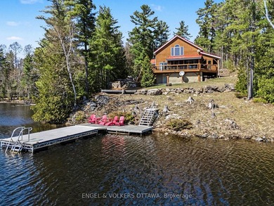 Set along the quiet shores of Shawenegog Lake, 1244 Marshall - photo 1