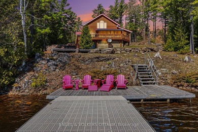 Set along the quiet shores of Shawenegog Lake, 1244 Marshall - photo 2
