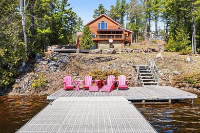 Set along the quiet shores of Shawenegog Lake, 1244 Marshall - photo 3