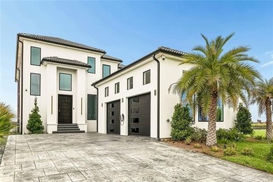 Experience true waterfront luxury in Lakeshore Estates with this - photo 1