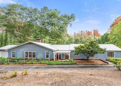 Beautiful Mid-Century Modern Cedar Sided Rach on over 15 acres - photo 2