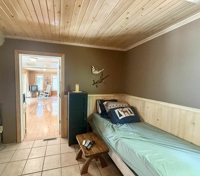 Surrounded by towering pines and overlooking a private pond - photo 11