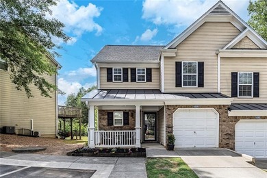 Located in Victoria Crossing, this end-unit townhome offers - photo 1