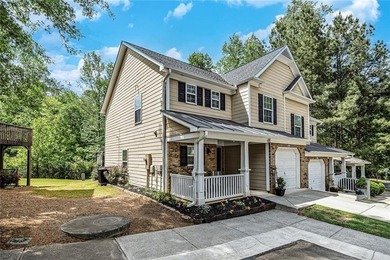 Located in Victoria Crossing, this end-unit townhome offers - photo 2