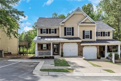 Located in Victoria Crossing, this end-unit townhome offers - photo 3