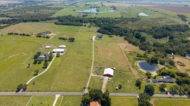 This breathtaking land features a pond & creek running through - photo 3