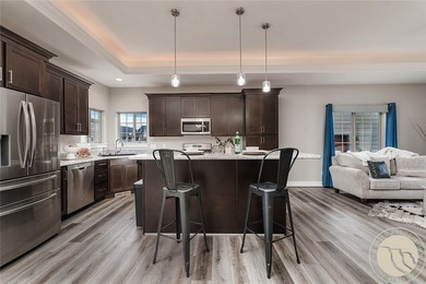 Bright, open & impeccably maintained! The upscale living room