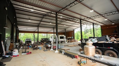 Still Mac Farm is a custom barndominium estate on 97 +/- acres - photo 50