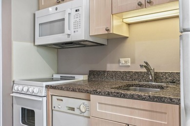 Welcome to this beautifully updated, fully furnished top-floor - photo 14