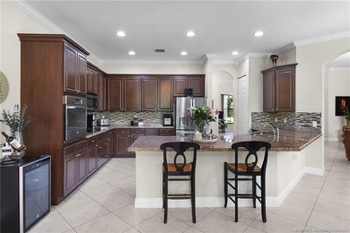 Nestled in The Falls of Jensen Beach, this spacious Kolter-built - photo 15