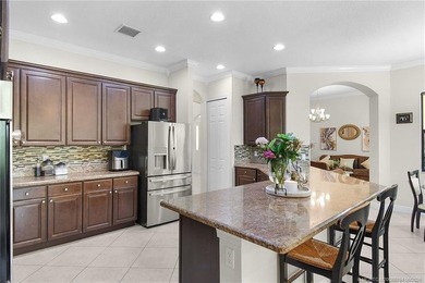 Nestled in The Falls of Jensen Beach, this spacious Kolter-built - photo 16