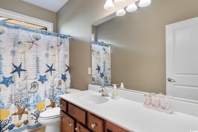 Experience the pinnacle of coastal luxury in this elegantly