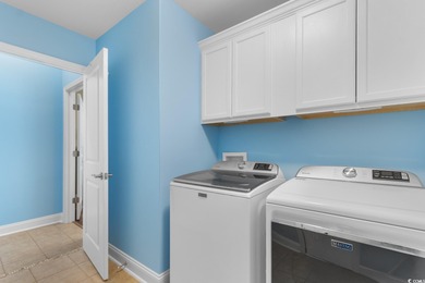 Experience the pinnacle of coastal luxury in this elegantly