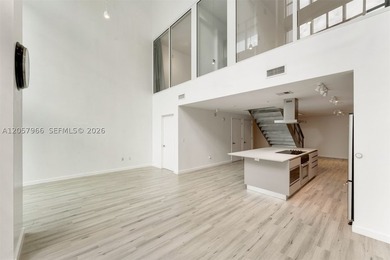 Experience soaring 25' ceilings in this 1,668 SF luxury loft in - photo 4