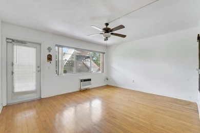 This 1st floor unit has a freshly painted interior and is a safe - photo 5