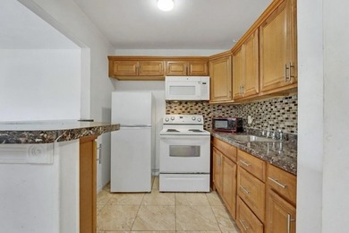 This 1st floor unit has a freshly painted interior and is a safe - photo 10