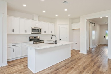 New construction 3BR/2BA home in Game Farm subdivision featuring - photo 12