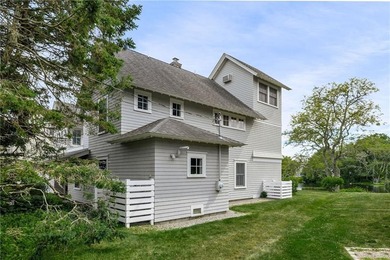 Perched at the water's edge, 19 Teal Drive is a custom-built - photo 11