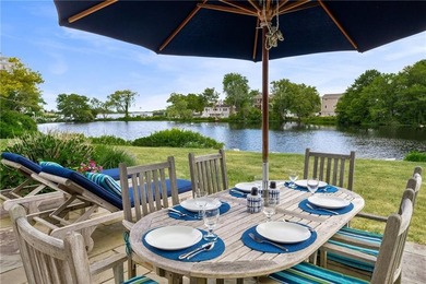 Perched at the water's edge, 19 Teal Drive is a custom-built - photo 15