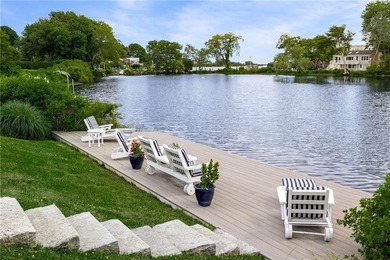 Perched at the water's edge, 19 Teal Drive is a custom-built - photo 16