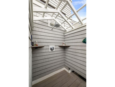 Perched at the water's edge, 19 Teal Drive is a custom-built - photo 17