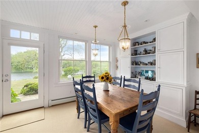 Perched at the water's edge, 19 Teal Drive is a custom-built - photo 20