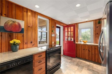 Perched at the water's edge, 19 Teal Drive is a custom-built - photo 24