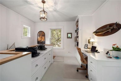 Perched at the water's edge, 19 Teal Drive is a custom-built - photo 29