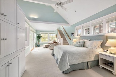 Perched at the water's edge, 19 Teal Drive is a custom-built - photo 30