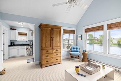 Perched at the water's edge, 19 Teal Drive is a custom-built - photo 40