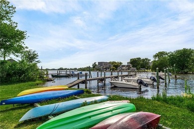 Perched at the water's edge, 19 Teal Drive is a custom-built - photo 50